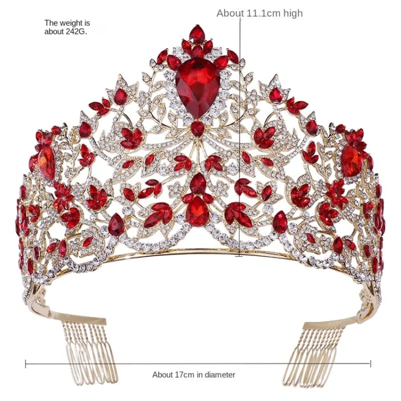 Ornate tiara featuring red gemstones and diamonds in an intricate floral design.