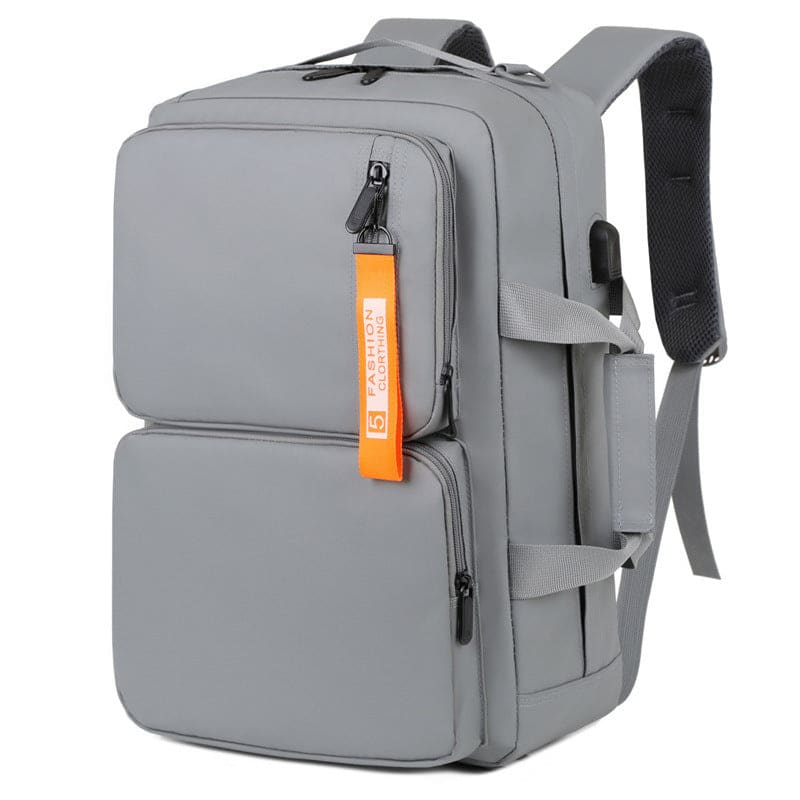 Gray backpack with multiple compartments and an orange tag.