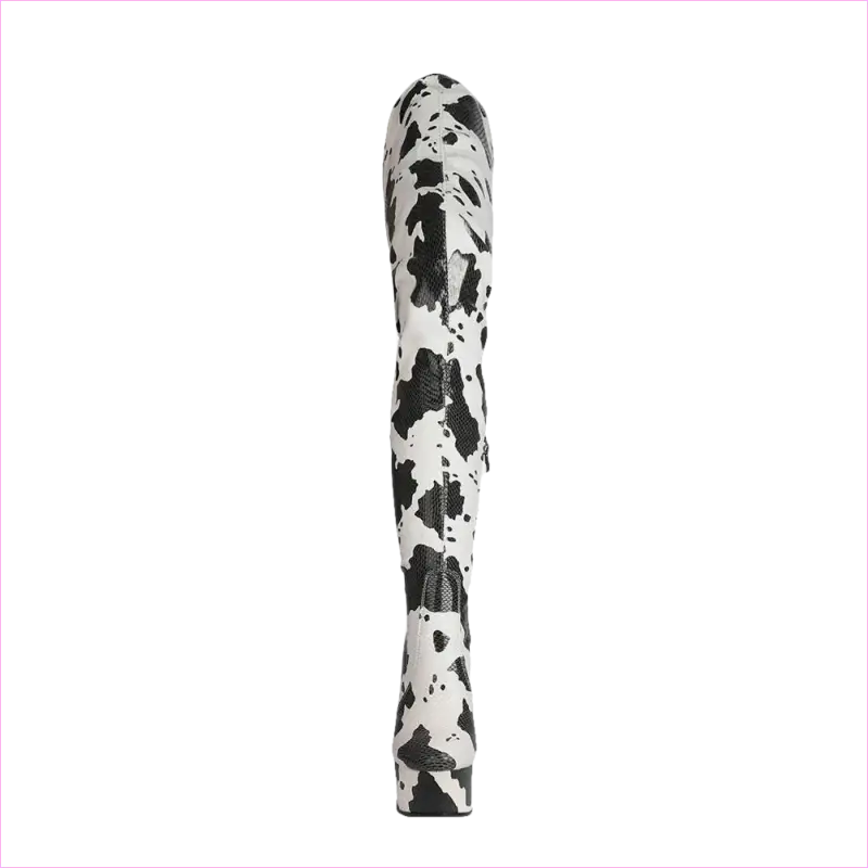 Tall, cylindrical object with a black and white spotted or splattered pattern.