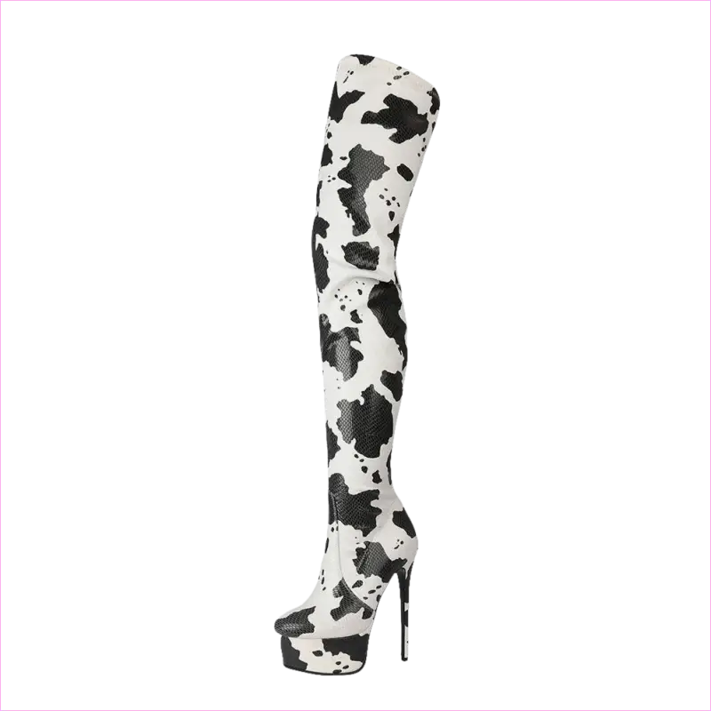 Thigh-high platform boot with a black and white cow print pattern.
