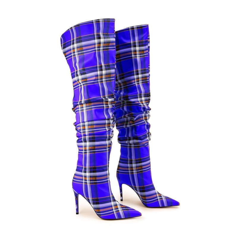 Pair of knee-high stiletto boots in a vibrant blue plaid pattern.
