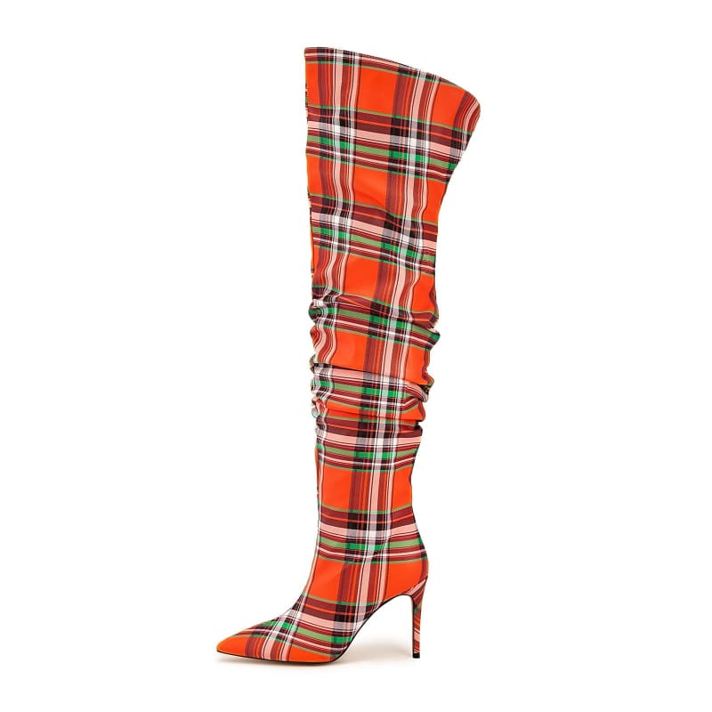 Tall, plaid-patterned high-heeled boot with a pointed toe and slouchy shaft.