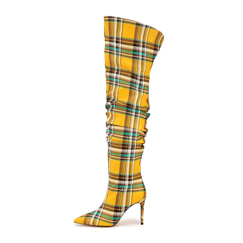 Tall yellow plaid high-heeled boot with a pointed toe and stiletto heel.
