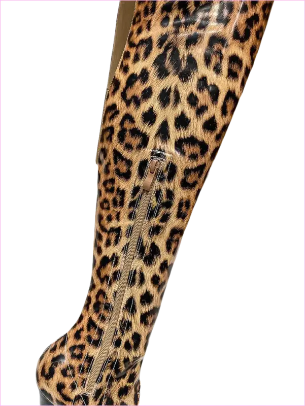 Leopard-print leggings or tights worn on a leg.