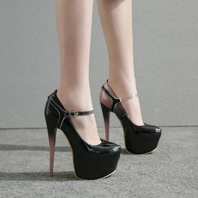 Black patent leather platform heel drag queen shoes with removable ankle strap.