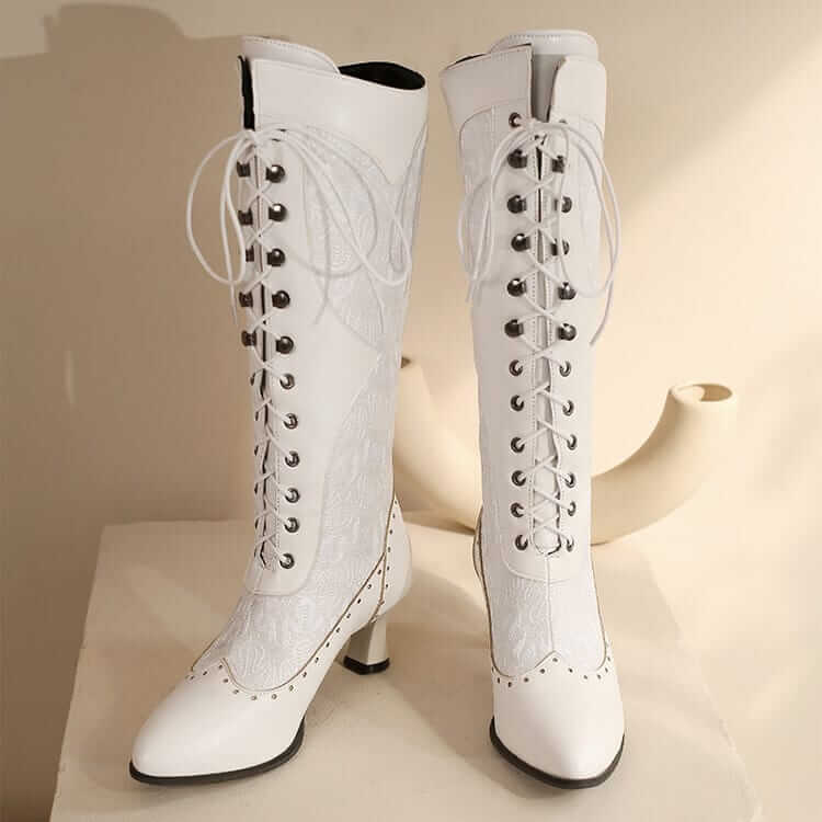 White leather Victorian style Steampunk lace-up boots with brogue detailing and heels.