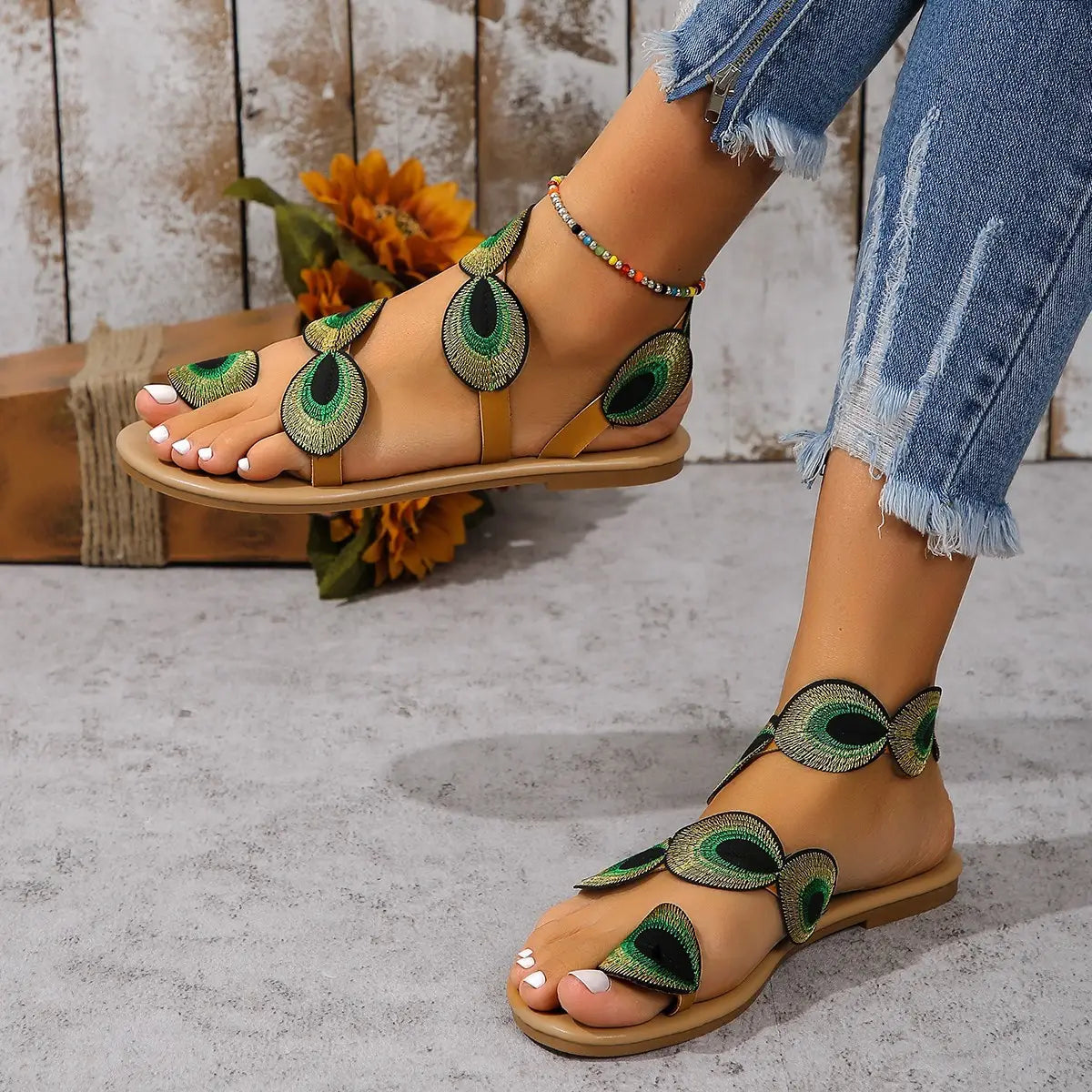 Bohemian green leather sandals with beautiful peacock pattern embroidered details.