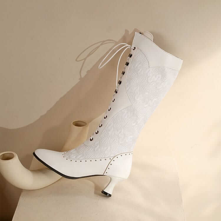 White Victorian-style lace-up boot with curved heel for stylish steampunk lace lovers.