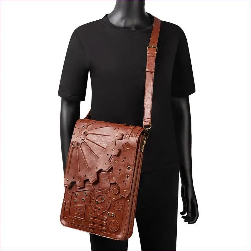 Brown leather messenger bag with embossed steampunk-inspired designs.