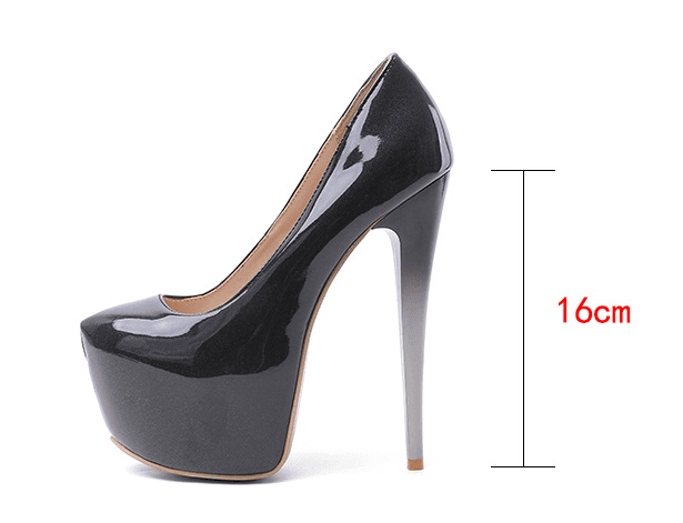 Black patent leather platform heel drag queen shoes with removable ankle strap and high heel.
