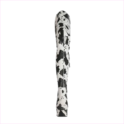 Tall, cylindrical object with a black and white spotted or splattered pattern.