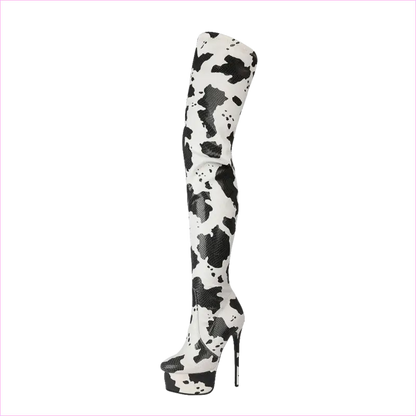 Thigh-high platform boot with a black and white cow print pattern.