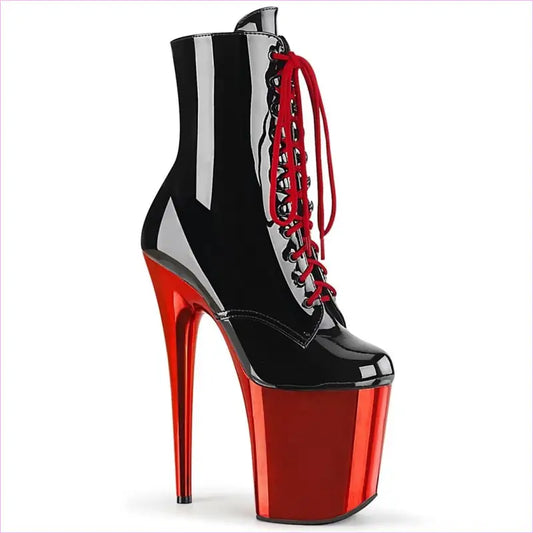 Extremely high platform ankle boot with black upper, red laces, and metallic red stiletto heel and platform.