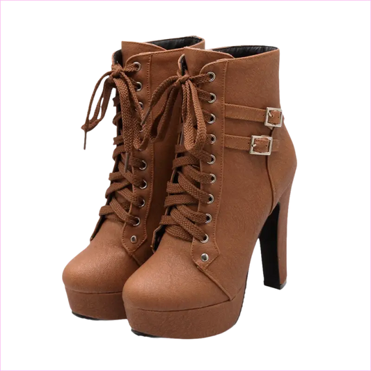 Pair of brown high-heeled ankle boots with laces and buckle straps.