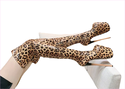 Leopard-print bodysuit or costume stretched across a white couch.