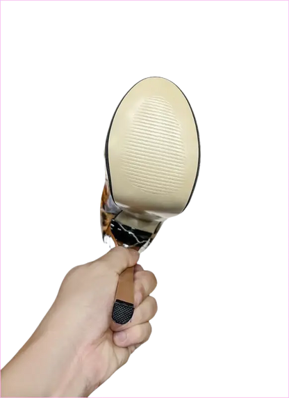 Hand-held magnifying glass with a round lens and metal handle.