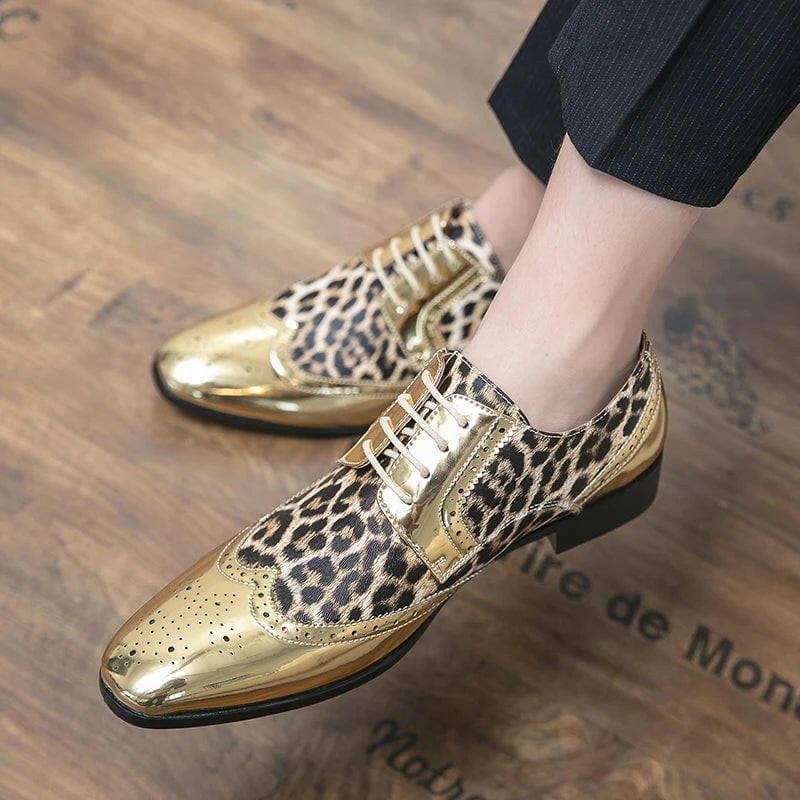 Gold and leopard print oxford-style dress shoes with metallic accents.