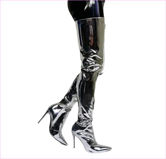 Pair of shiny silver thigh-high stiletto boots with pointed toes.