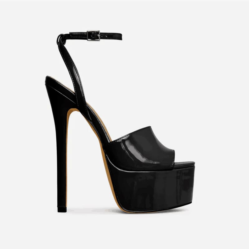Black high-heeled platform sandal with an ankle strap.